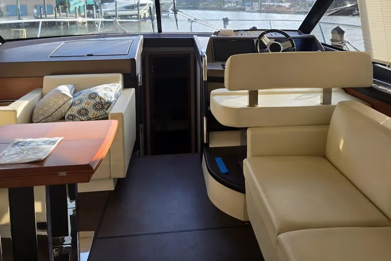 What A Day Yacht Photos Pics Luxurious interior of a 2013 Prestige 500 yacht with elegant seating and helm.