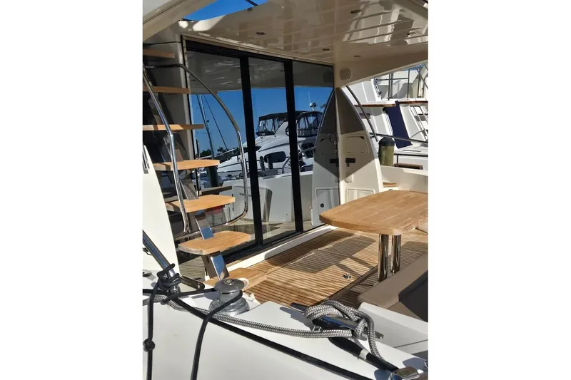 What A Day Yacht Photos Pics Interior view of 2013 Prestige 500 yacht with wooden stairs and table.