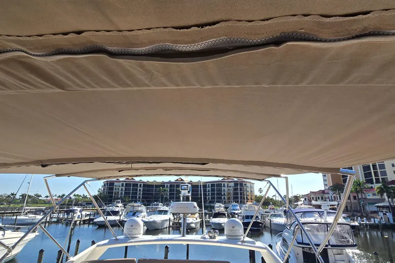 What A Day Yacht Photos Pics View from a 2013 Prestige 500 yacht, overlooking a marina with multiple boats docked.