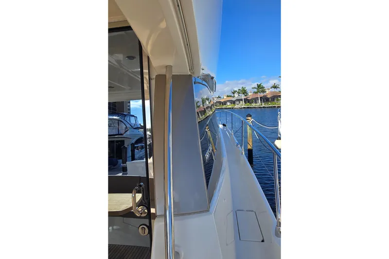 What A Day Yacht Photos Pics Side view of a 2013 Prestige 500 yacht docked by a waterfront.