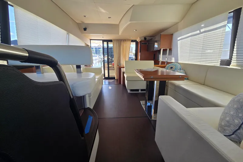 What A Day Yacht Photos Pics Luxurious interior of a 2013 Prestige 500 yacht with elegant seating and dining area.