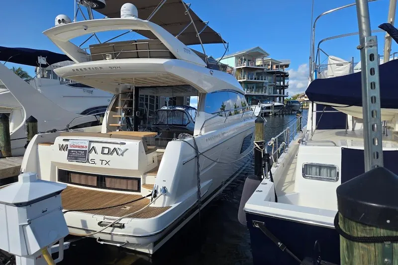 What A Day Yacht Photos Pics Luxury 2013 Prestige 500 yacht docked at marina, sunny day, waterfront view.