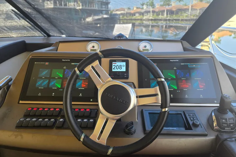 What A Day Yacht Photos Pics Cockpit of 2013 Prestige 500 yacht with advanced navigation displays and controls.