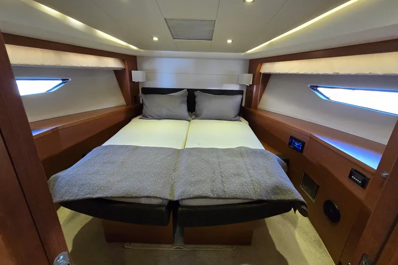 What A Day Yacht Photos Pics Luxurious cabin interior of 2013 Prestige 500 yacht with cozy bedding and ambient lighting.