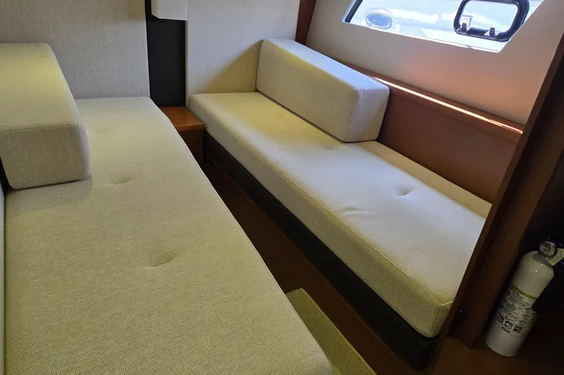 What A Day Yacht Photos Pics Interior of 2013 Prestige 500 yacht with beige seating and window view.