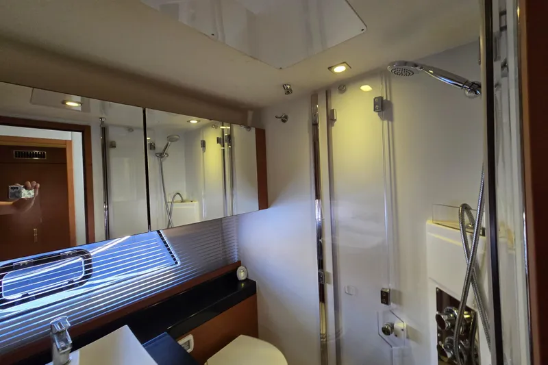 What A Day Yacht Photos Pics Luxurious bathroom interior of 2013 Prestige 500 yacht with modern fixtures and shower.