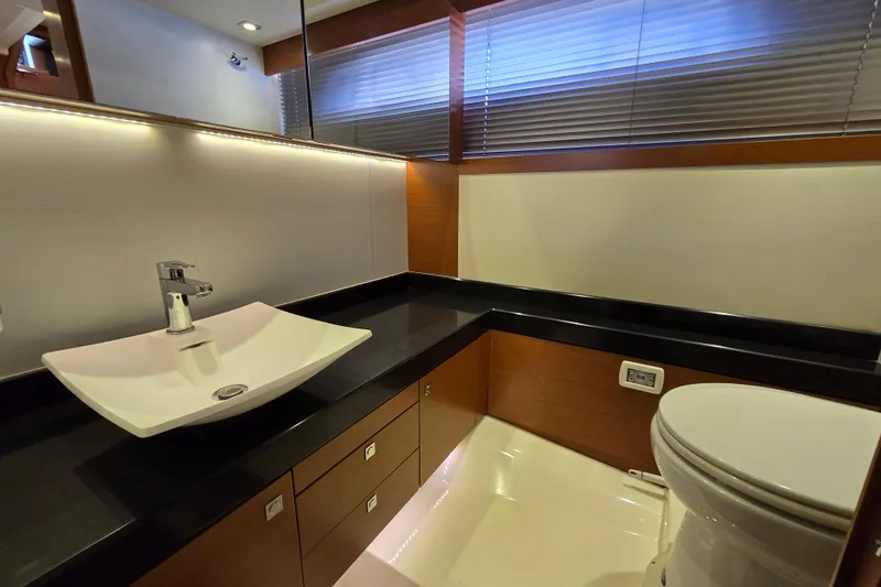 What A Day Yacht Photos Pics Luxurious bathroom in 2013 Prestige 500 yacht with modern sink and toilet.