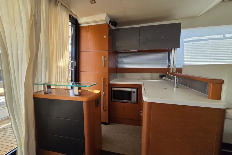 What A Day Yacht Photos Pics Luxurious interior of a 2013 Prestige 500 yacht featuring a modern kitchen design.