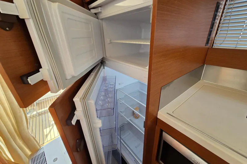 What A Day Yacht Photos Pics Refrigerator in 2013 Prestige 500 yacht kitchen, open with empty shelves.