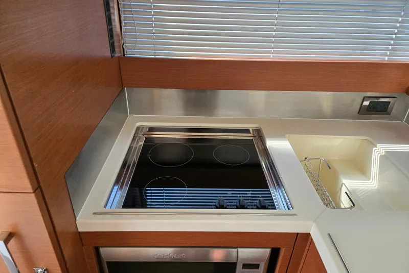 What A Day Yacht Photos Pics Modern kitchen in 2013 Prestige 500 yacht with stovetop and sink.