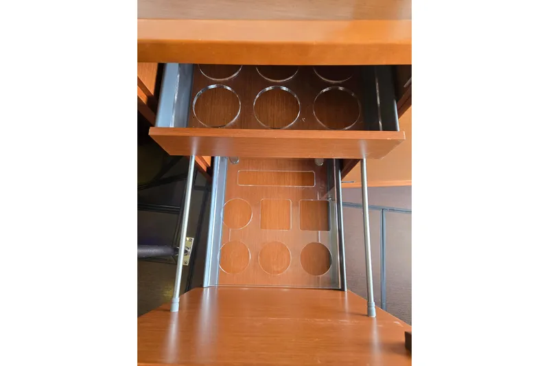 What A Day Yacht Photos Pics Wooden drawer with circular and rectangular cutouts, part of a 2013 Prestige 500 model.