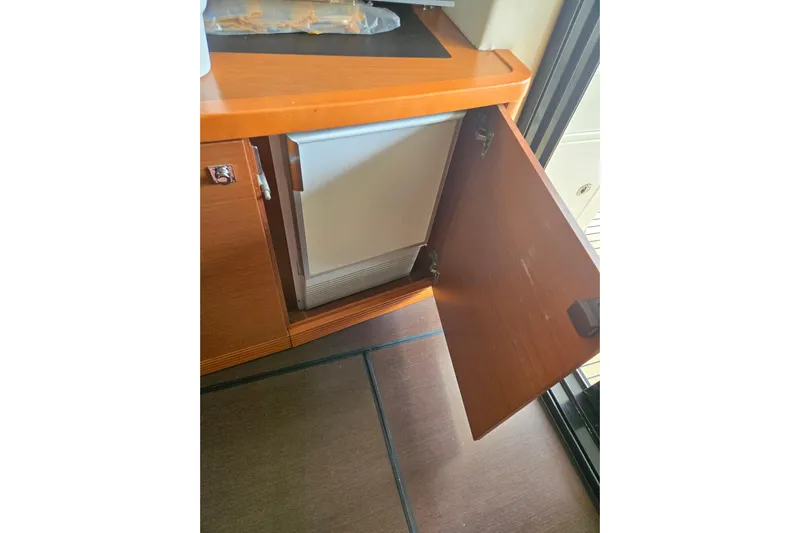 What A Day Yacht Photos Pics Open cabinet with built-in fridge on a 2013 Prestige 500 yacht.