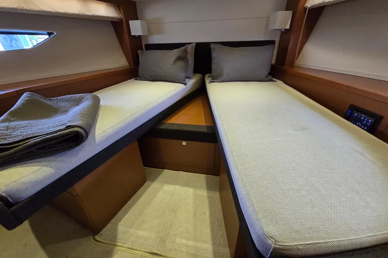 What A Day Yacht Photos Pics Twin beds in a 2013 Prestige 500 yacht cabin, featuring modern design and cozy bedding.