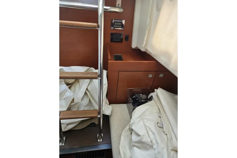 What A Day Yacht Photos Pics Interior of 2013 Prestige 500 yacht with wooden ladder and storage area.