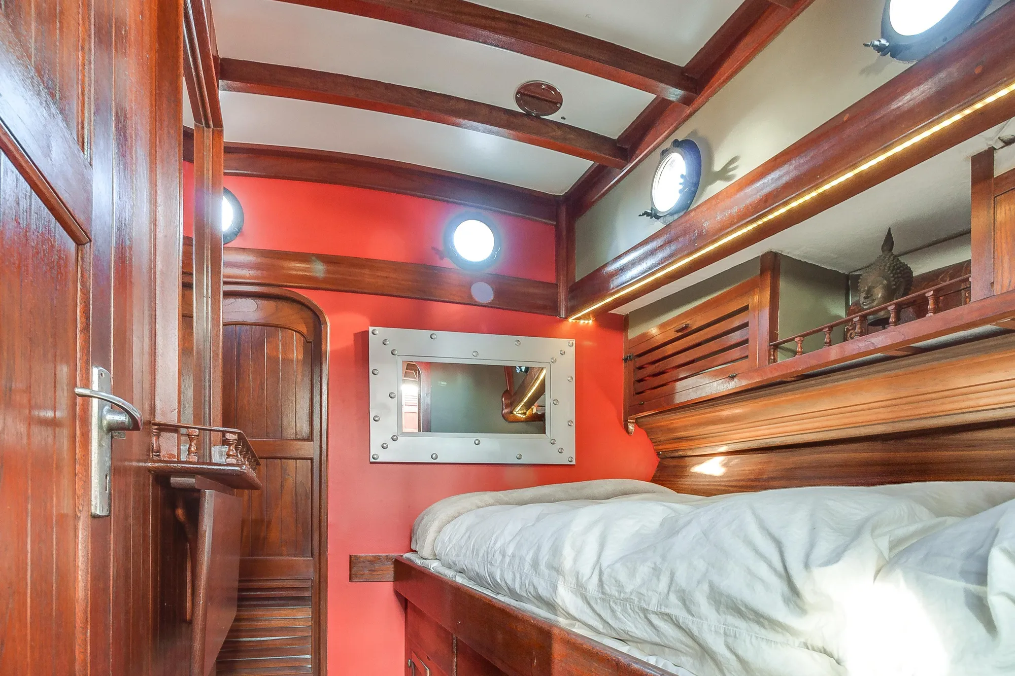 1971 Formosa 41 yacht interior with wooden accents and cozy sleeping area.