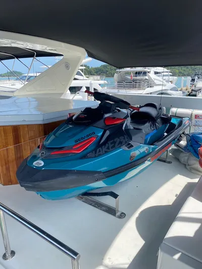 Demarest Yacht Photos Pics Jet ski on Falcon 106 yacht, 2002 model, docked at marina with other boats.