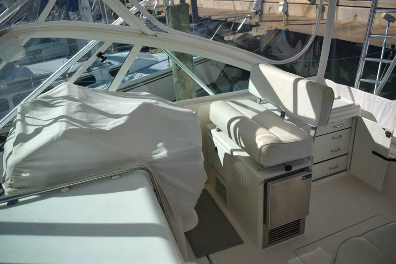 Never Again VII Yacht Photos Pics 2006 Cabo 35 Express boat interior with seating and storage compartments.