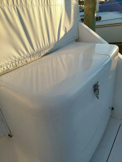 Never Again VII Yacht Photos Pics 2006 Cabo 35 Express boat with white storage compartment and latch.