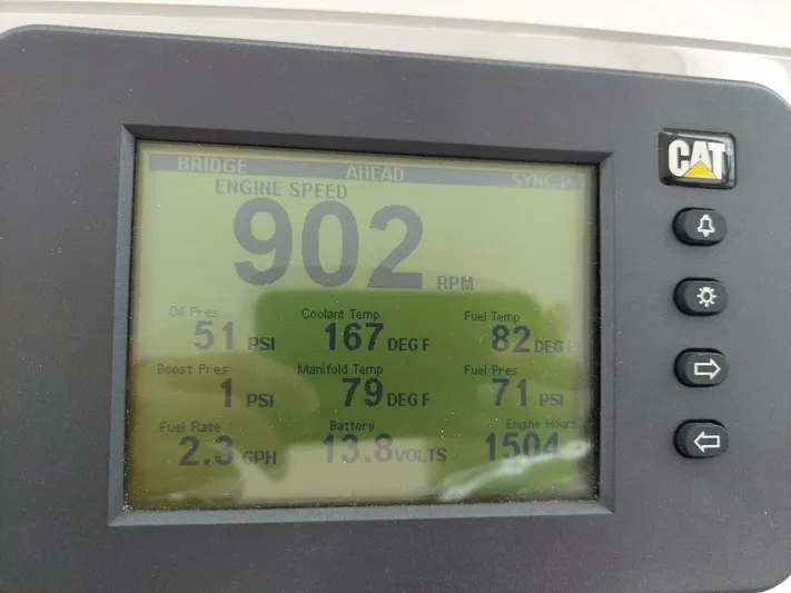 Never Again VII Yacht Photos Pics Display screen showing engine metrics for a 2006 Cabo 35 Express boat.