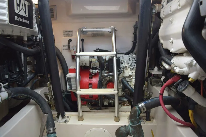 Never Again VII Yacht Photos Pics Engine room of a 2006 Cabo 35 Express boat with CAT Marine Power components.