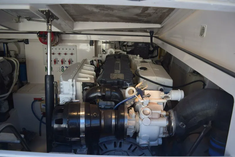 Never Again VII Yacht Photos Pics Engine room of a 2006 Cabo 35 Express boat, showcasing mechanical components and systems.