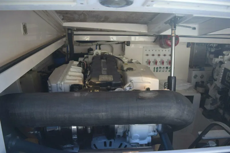 Never Again VII Yacht Photos Pics Engine room of a 2006 Cabo 35 Express boat, showcasing machinery and components.