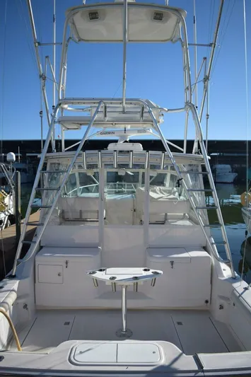 Never Again VII Yacht Photos Pics 2006 Cabo 35 Express boat with spacious deck and fishing tower.