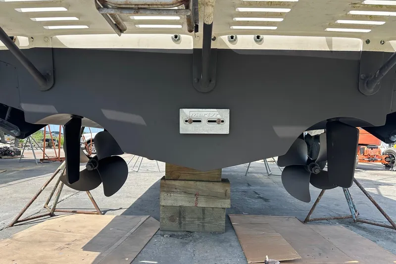 Never Again VII Yacht Photos Pics 2006 Cabo 35 Express boat propellers and stern view on dry dock.