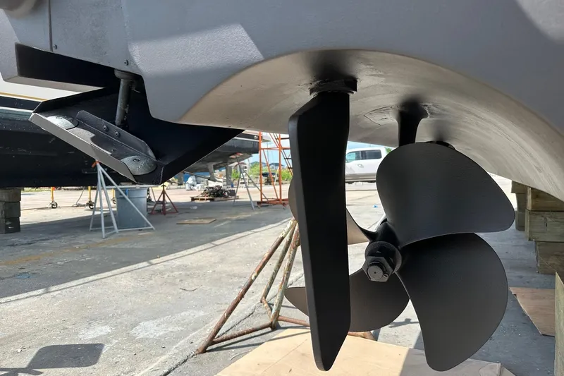 Never Again VII Yacht Photos Pics 2006 Cabo 35 Express boat propeller and rudder in dry dock.