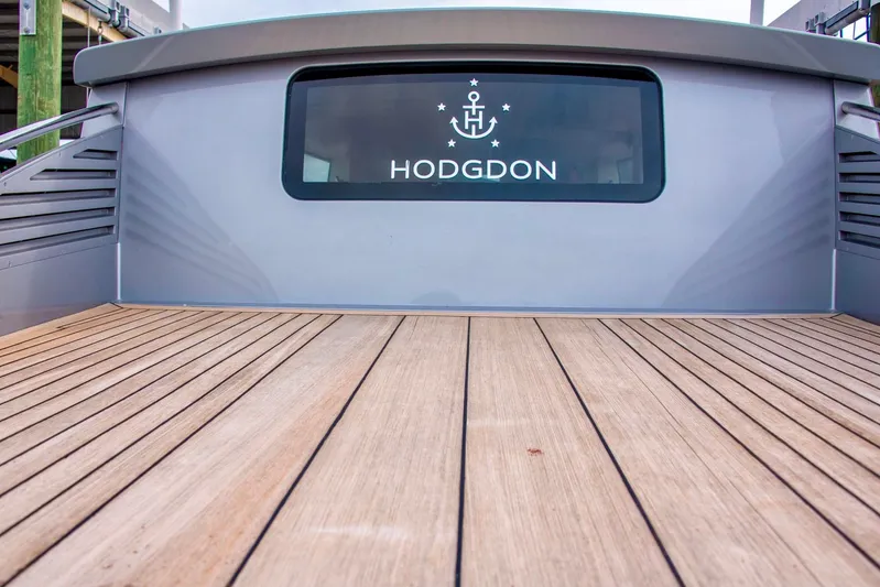  Yacht Photos Pics Hodgdon Venetian 2016 boat deck with wooden flooring and branded window.