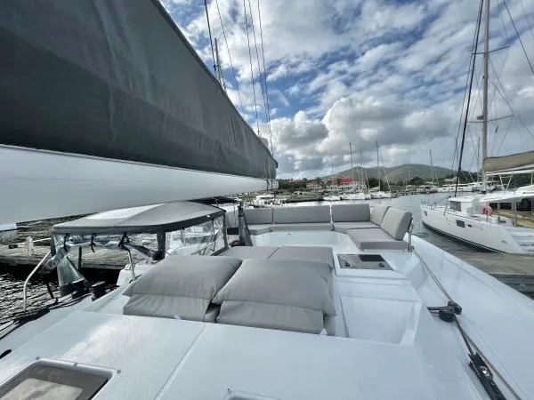 Sea The World Yacht Photos Pics 2023 Fountaine Pajot Elba 45 catamaran with spacious deck and comfortable seating.