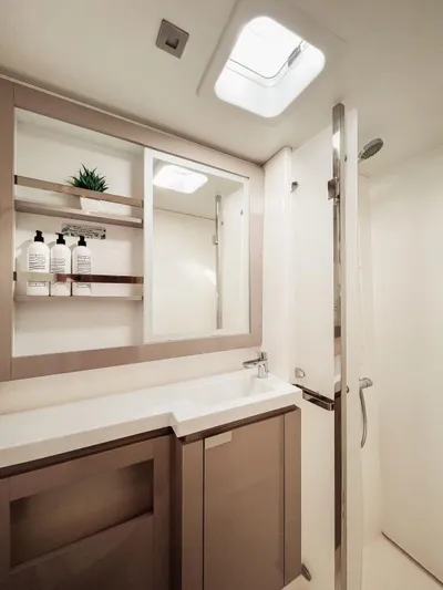 Sea The World Yacht Photos Pics Modern bathroom in 2023 Fountaine Pajot Elba 45 yacht with sleek design and natural light.