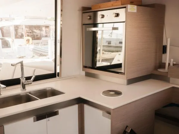 Sea The World Yacht Photos Pics Modern kitchen interior of 2023 Fountaine Pajot Elba 45 yacht with sleek design.