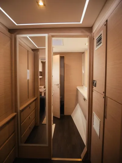 Sea The World Yacht Photos Pics Interior of 2023 Fountaine Pajot Elba 45 yacht, featuring modern wood paneling and sleek design.