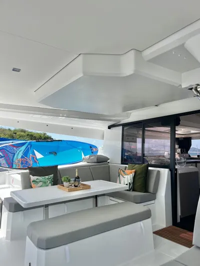 Sea The World Yacht Photos Pics 2023 Fountaine Pajot Elba 45 yacht interior with modern seating and decor.
