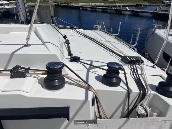 Sea The World Yacht Photos Pics 2023 Fountaine Pajot Elba 45 yacht deck with winches and rigging in marina.