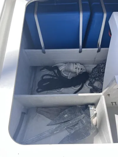 Sea The World Yacht Photos Pics Storage compartment of 2023 Fountaine Pajot Elba 45 with ropes and anchor.