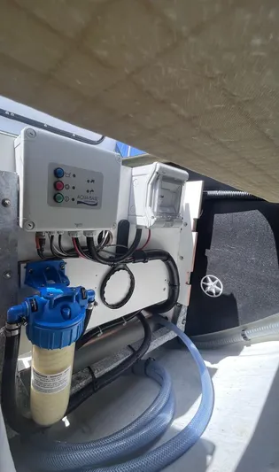 Sea The World Yacht Photos Pics Engine compartment of 2023 Fountaine Pajot Elba 45 with control panel and filtration system.