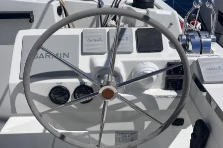 Sea The World Yacht Photos Pics Steering wheel of 2023 Fountaine Pajot Elba 45 catamaran with Garmin navigation system.