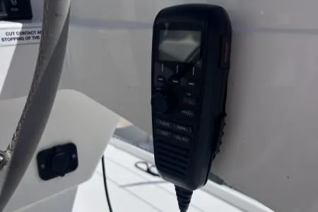 Sea The World Yacht Photos Pics VHF radio on 2023 Fountaine Pajot Elba 45 yacht dashboard.