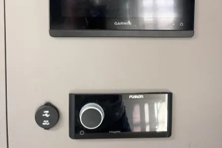 Sea The World Yacht Photos Pics Control panel on 2023 Fountaine Pajot Elba 45, featuring Garmin and Fusion systems.