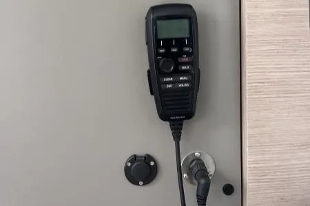 Sea The World Yacht Photos Pics VHF radio on 2023 Fountaine Pajot Elba 45 yacht interior wall.