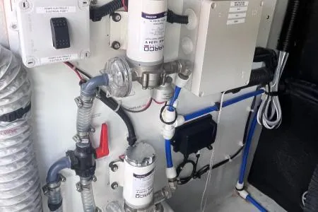 Sea The World Yacht Photos Pics Engine room of 2023 Fountaine Pajot Elba 45 with mechanical components and wiring.