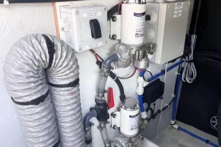 Sea The World Yacht Photos Pics Engine room of 2023 Fountaine Pajot Elba 45 with ventilation ducts and mechanical components.