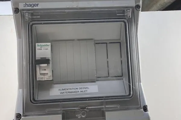 Sea The World Yacht Photos Pics Electrical panel on 2023 Fountaine Pajot Elba 45, featuring Schneider circuit breaker.