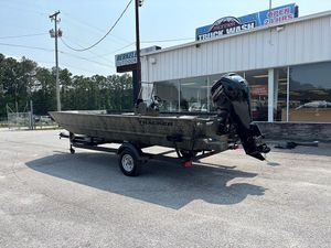 2025 Tracker Grizzly 2072 CC boat on trailer outside a truck wash facility.