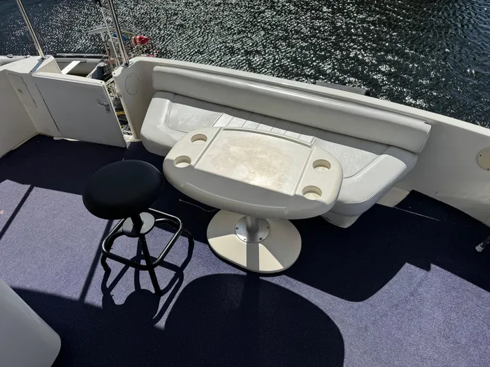  Yacht Photos Pics 1998 Sea Ray 420 Aft Cabin yacht deck with seating and table, overlooking water.