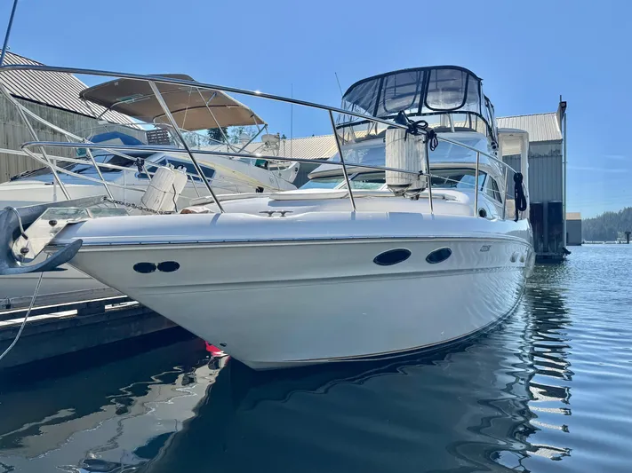  Yacht Photos Pics 1998 Sea Ray 420 Aft Cabin yacht docked at marina under clear blue sky.