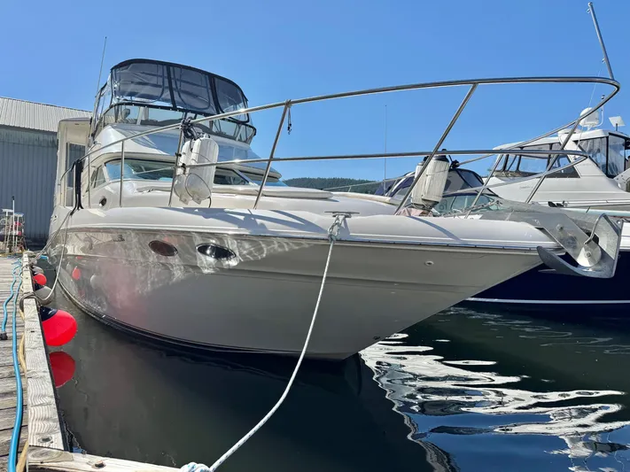  Yacht Photos Pics 1998 Sea Ray 420 Aft Cabin yacht docked at marina under clear blue sky.