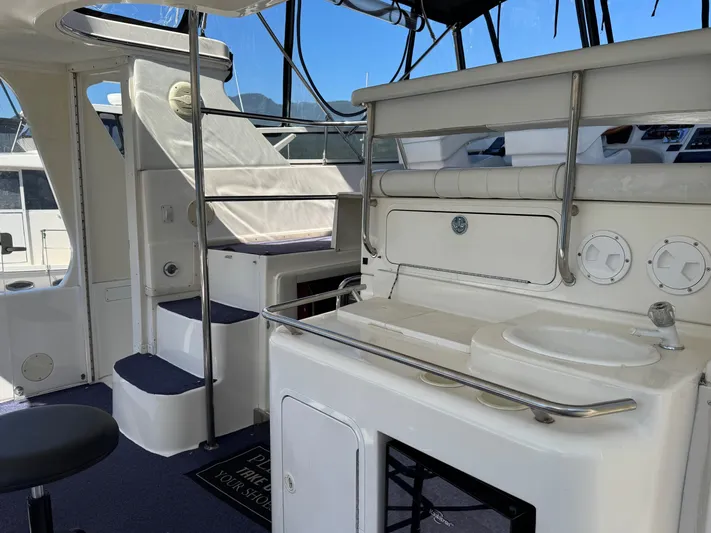  Yacht Photos Pics 1998 Sea Ray 420 Aft Cabin interior with seating and helm station.